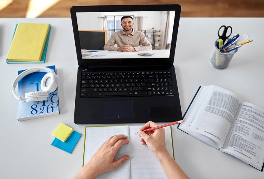 Student with laptop having online class